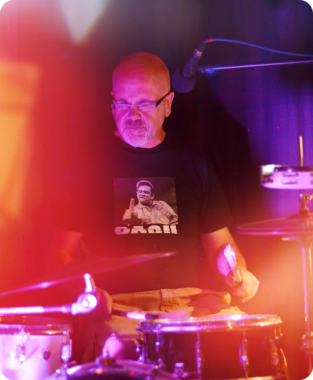 A man playing drums in Hot Spot venue